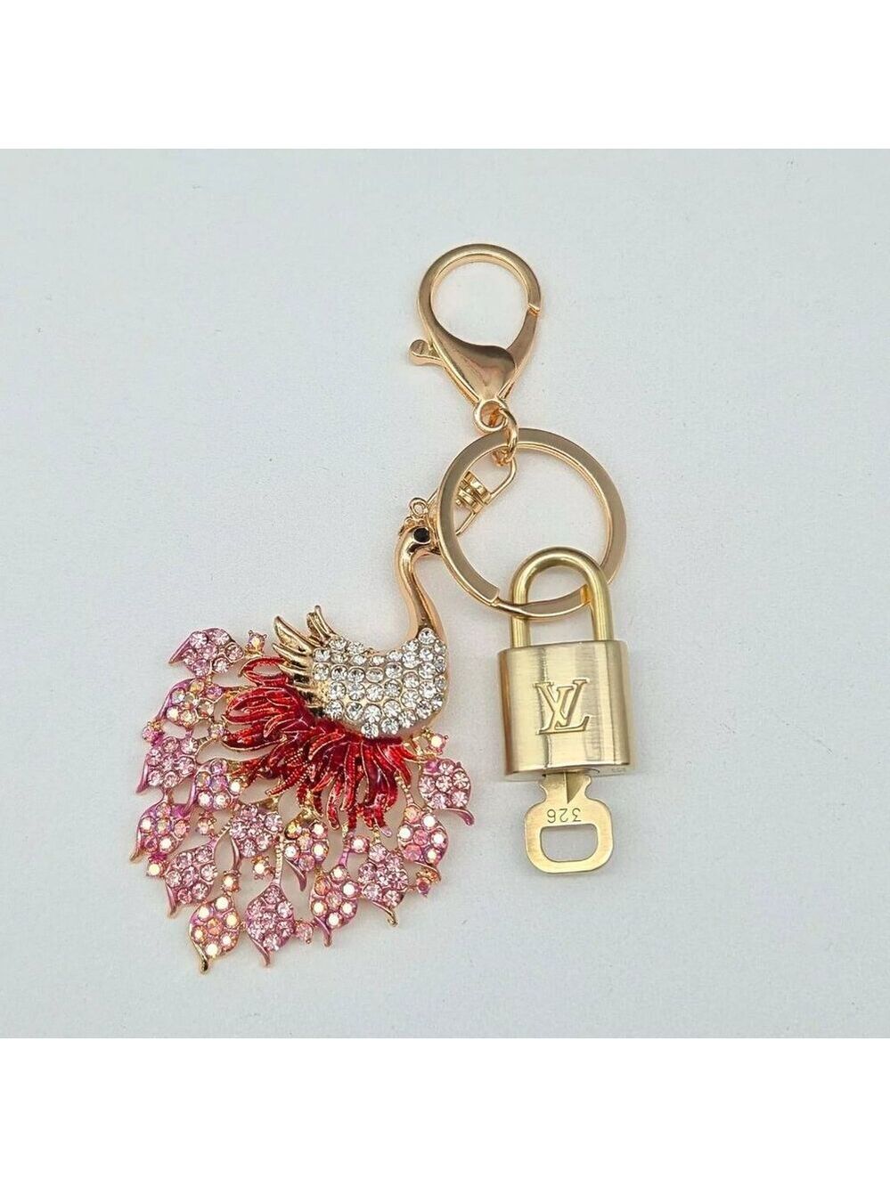 Authentic Louis Vuitton Lock & Key with unbranded Peacock Bagcharm, Keycharm
